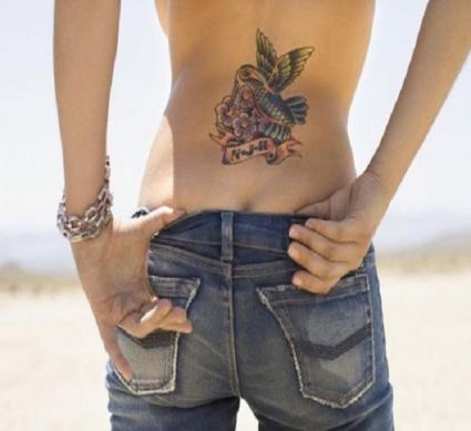 Hummingbird Pic Tattoo On Lower Back Of Girl